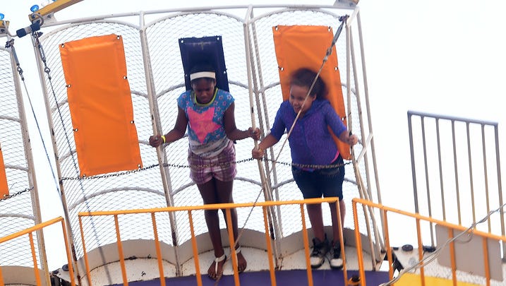 Children ride the Round-Up at the Lions Club Fair in Mercersburg on Tuesday, August 11, 2015. Ryan Blackwell - Public Opinion
