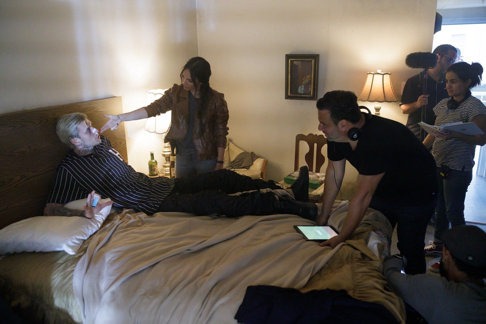 Megan Fox and Colson Baker prepare for a scene as director Randall Emmett (right) looks on.