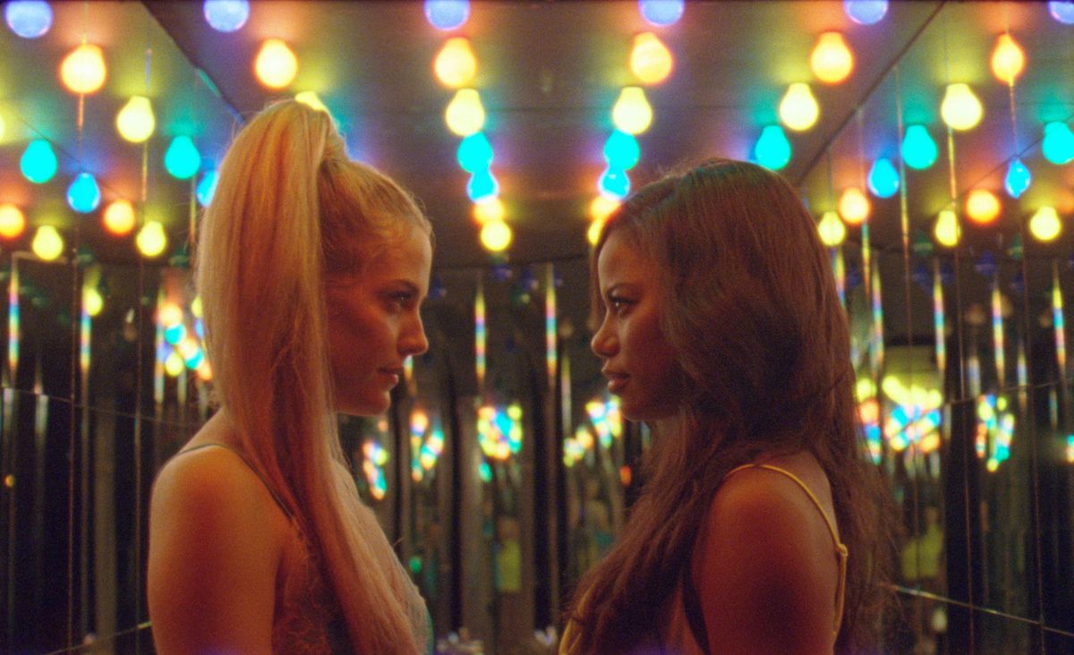 zola and another girl stand face to face